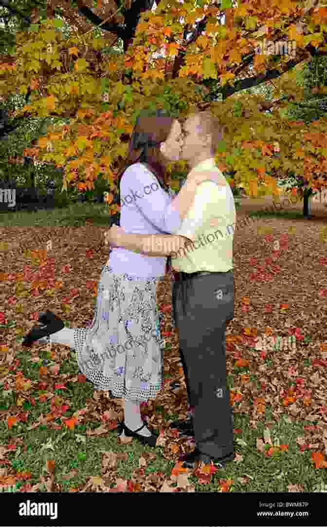 A Couple Embraces On A Football Field, Surrounded By Autumn Leaves. Homecoming: Forget Me Not: A Second Chance Romance