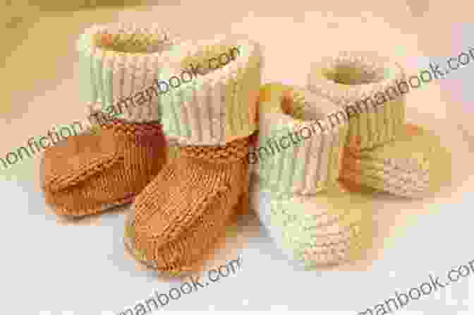An Adorable Pair Of Hand Knitted Baby Shoes Featuring The SSK Stitch And Delicate Lace Detailing SSK Pretty Baby Shoes Knitting Pattern